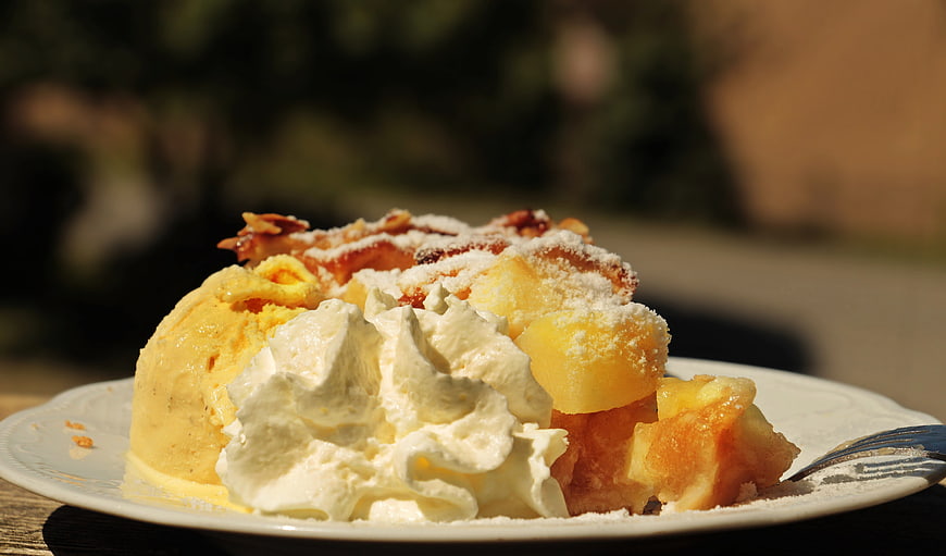 Apple Cake with Ice Cream and Whipped Cream on Plate