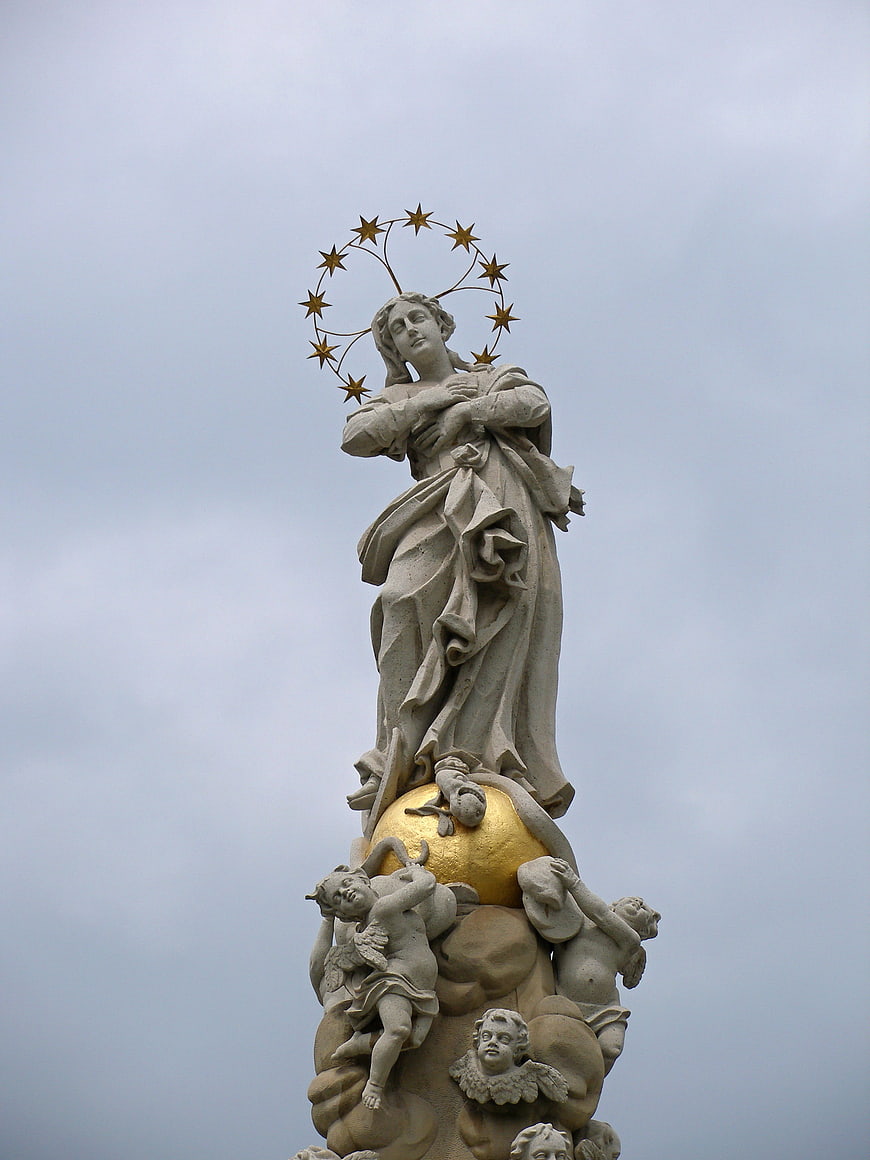 Statue of Our Lady of Fátima with golden stars and angels
