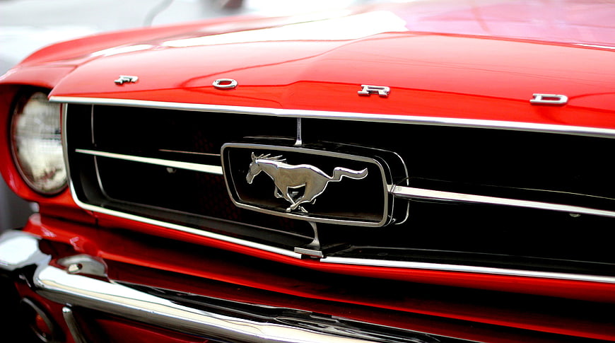 Close-up of Classic Red Ford Mustang Grille and Emblem