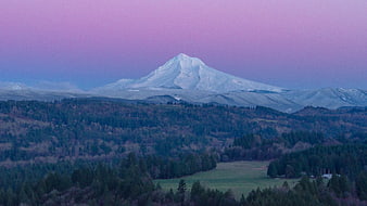 Snow-Capped Mountain Peak Against Purple Twilight Sky