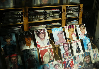 Vintage French Fashion Magazines Displayed in Wooden Rack