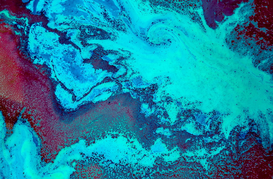 Abstract fluid art background with swirling blue and red paint