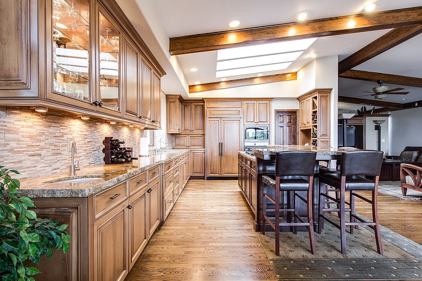Spacious luxury kitchen with wooden cabinets and island