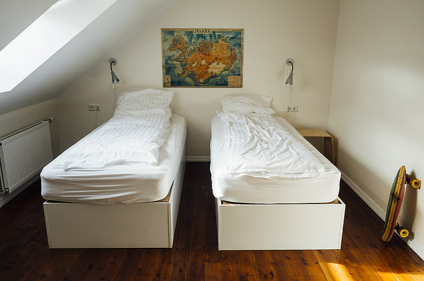 Cozy Attic Bedroom with Twin Beds and Vintage Map