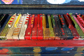 Close-up of colorful painted wooden piano keys