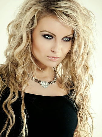 Portrait of Blonde Woman with Wavy Hair and Silver Necklace