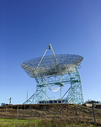 Large Radio Telescope Dish Against Blue Sky