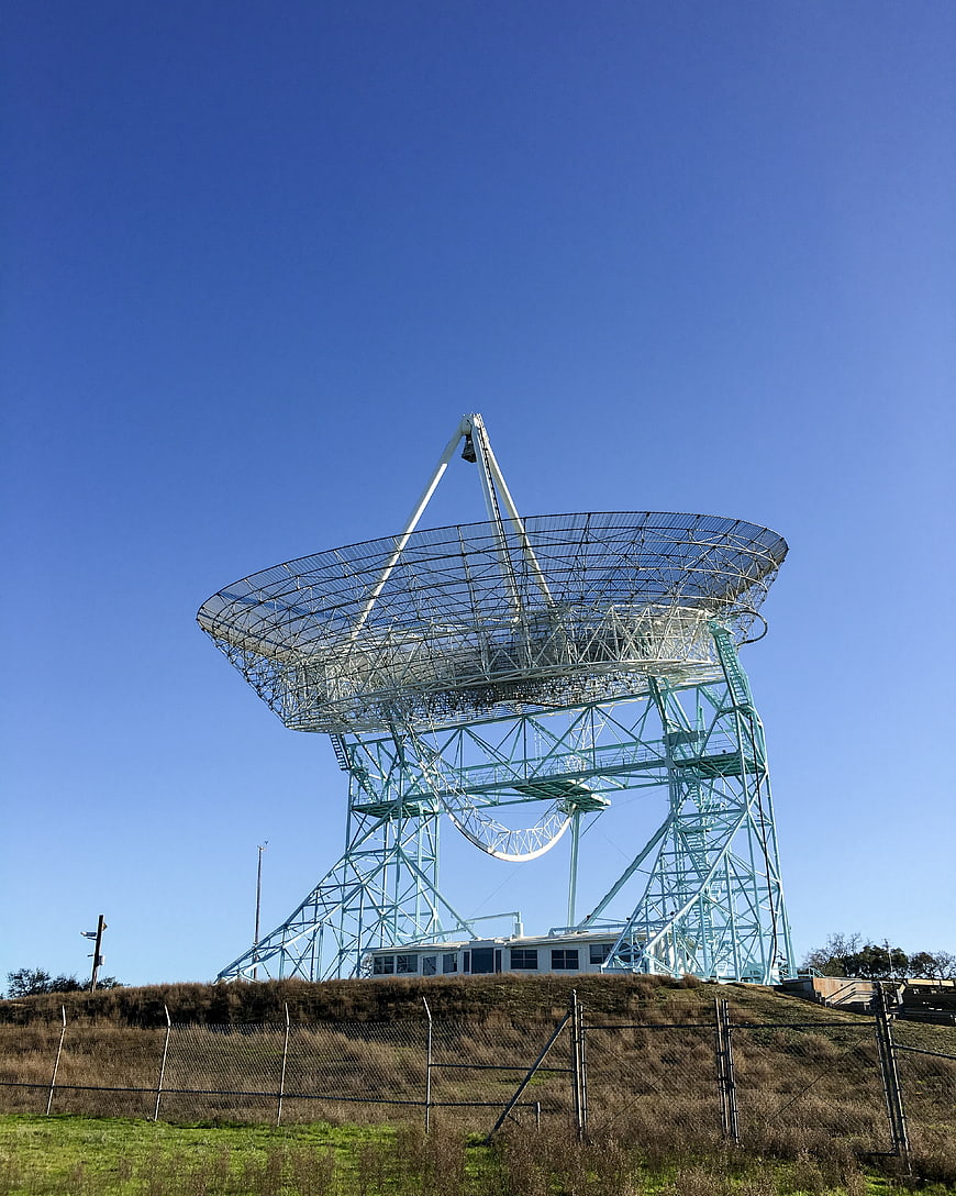 Large Radio Telescope Dish Against Blue Sky