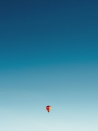 Minimalist Hot Air Balloon Against Blue Gradient Sky