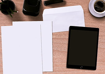 Top View Office Desk With Tablet, Envelope, Paper, Coffee, And Stationery