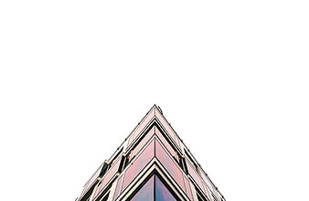 Low angle view of modern glass skyscraper against white sky
