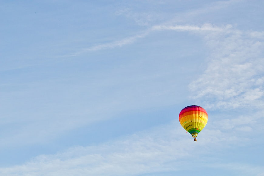 Colorful Hot Air Balloon Flying in Blue Sky