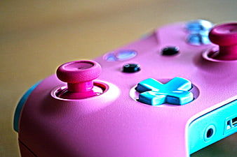Close-up of pink and blue custom gaming controller