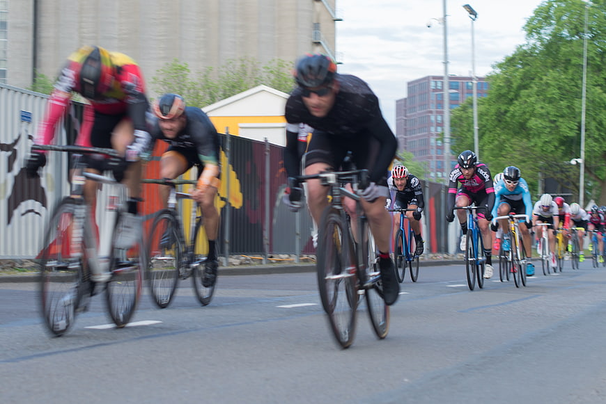 Group of cyclists racing on an urban street