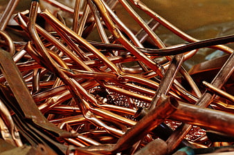 Close-up of tangled copper pipes and scrap metal for recycling