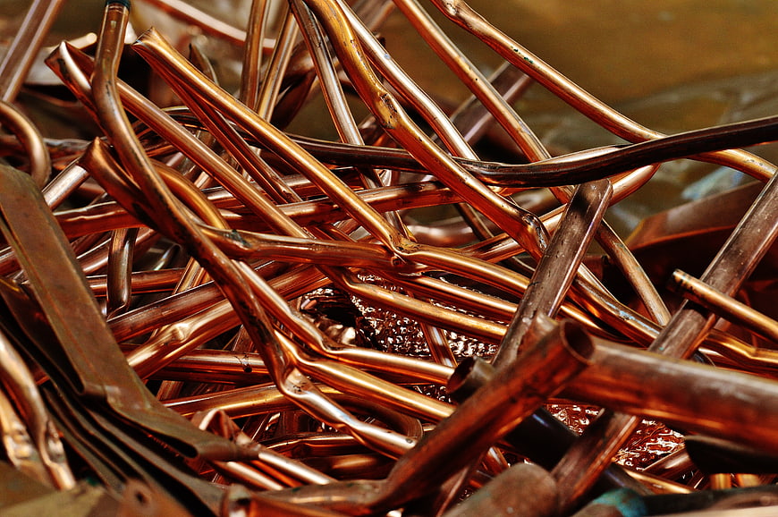 Close-up of tangled copper pipes and scrap metal for recycling
