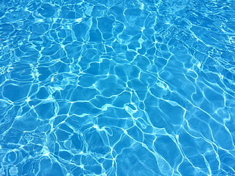 Blue Swimming Pool Water Surface with Caustic Light Reflections
