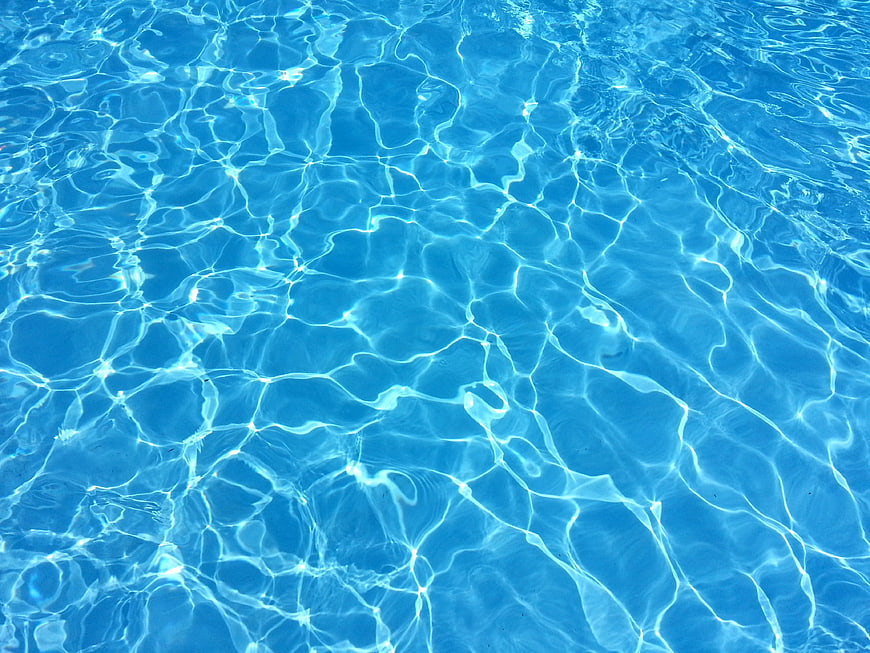 Blue Swimming Pool Water Surface with Caustic Light Reflections