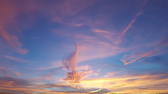 Vibrant sunset sky with pink and purple clouds