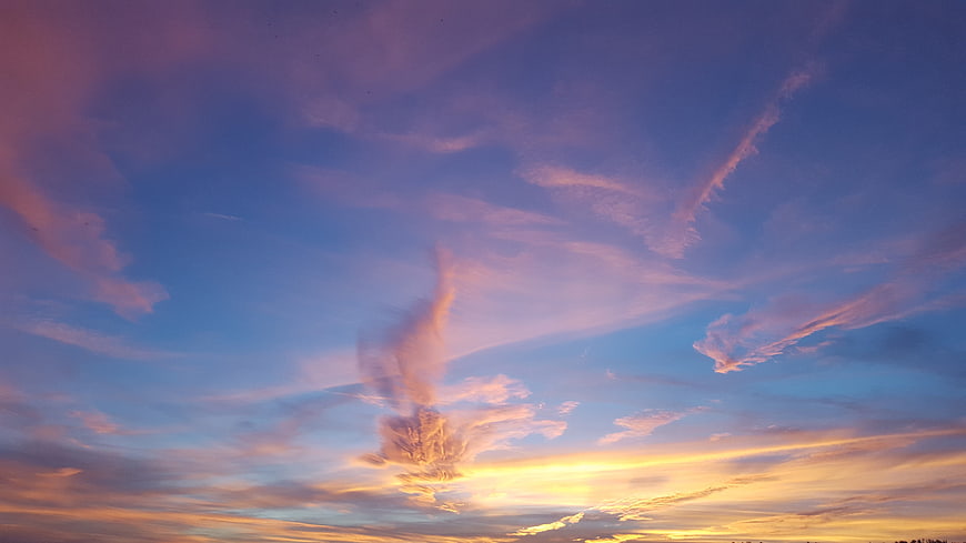 Vibrant sunset sky with pink and purple clouds