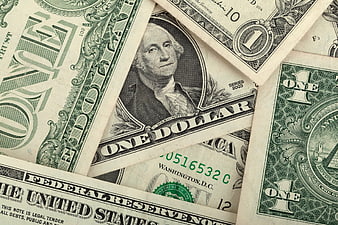 Scattered US One Dollar Bills Close-Up Background