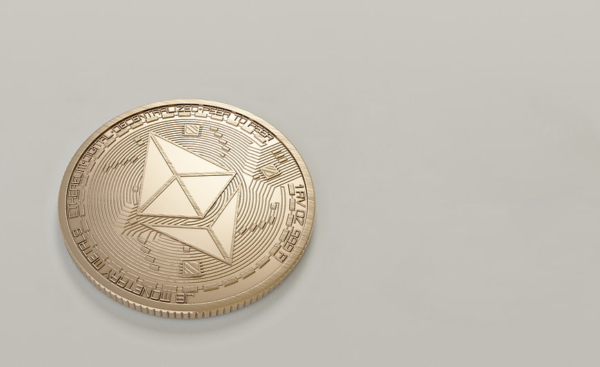 Physical Ethereum Coin on Gray Background