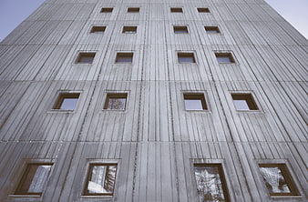 Low angle view of brutalist concrete building facade