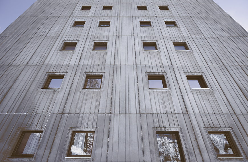 Low angle view of brutalist concrete building facade