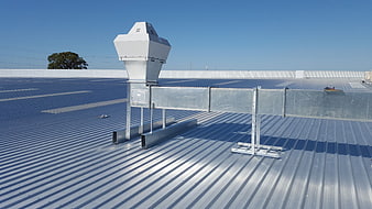 Commercial HVAC Ventilation System On Industrial Metal Roof