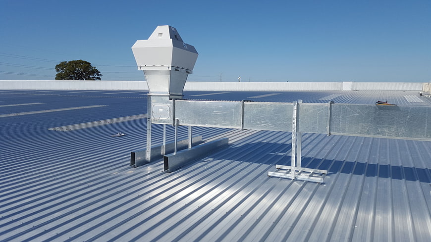 Commercial HVAC Ventilation System On Industrial Metal Roof