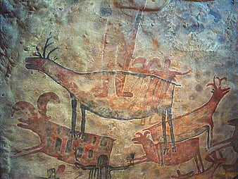 Ancient prehistoric cave painting of deer and human figures
