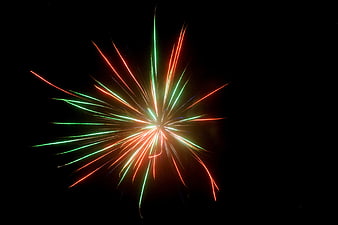 Colorful Fireworks Burst Against Black Night Sky