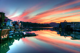Vibrant Sunset Over Waterfront Houses and Docks