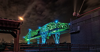 Illuminated Industrial Crane at Night with Neon Lights