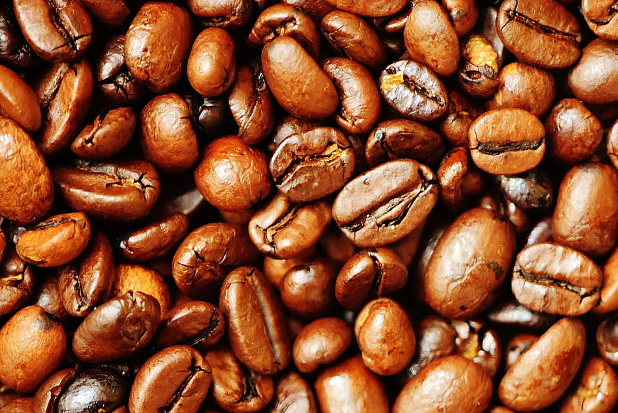 Close-up of roasted brown coffee beans texture