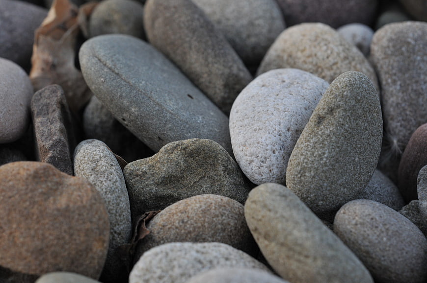 Close-up of smooth gray river stones and pebbles