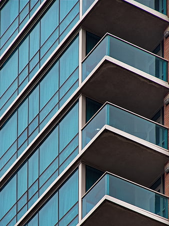 Modern Blue Glass Building Facade with Balconies