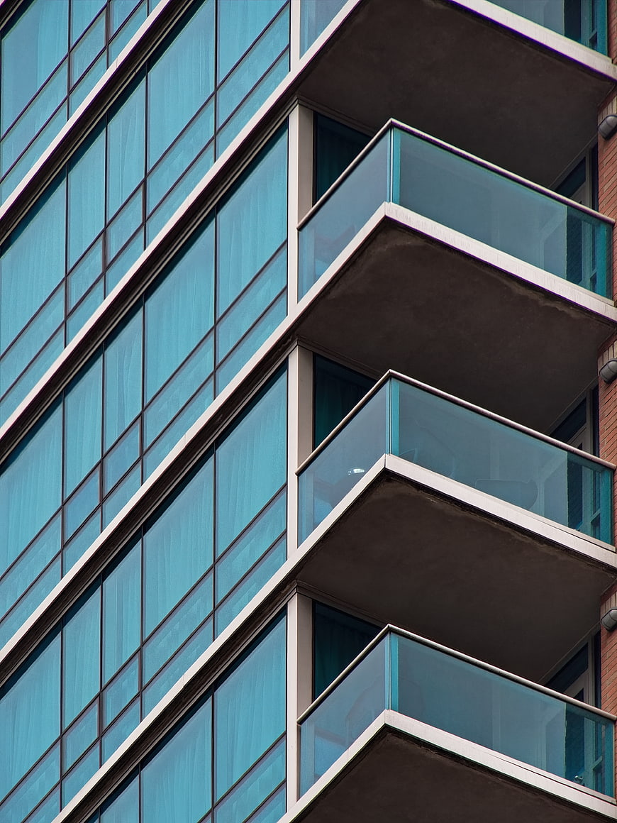 Modern Blue Glass Building Facade with Balconies