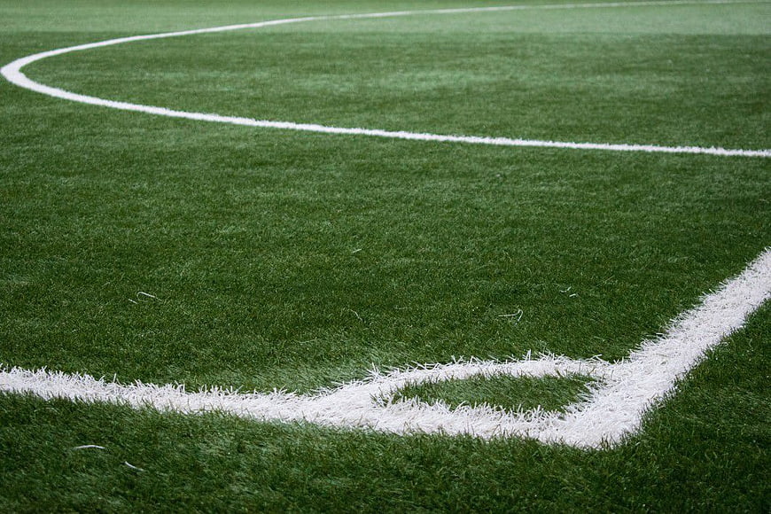 Green Soccer Field Corner with White Lines
