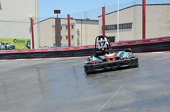 Empty go-kart number 17 on racetrack