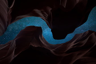 Starry Night Sky Viewed From Inside A Dark Sandstone Canyon