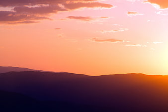 Silhouette of Mountain Range at Vibrant Sunset