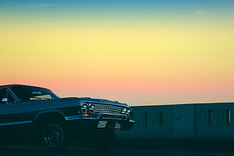 Vintage Classic Car Parked Against Sunset Sky
