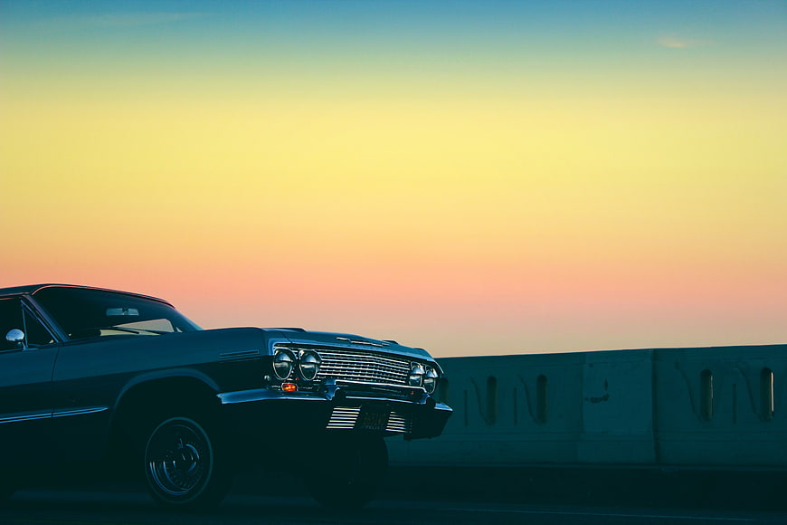 Vintage Classic Car Parked Against Sunset Sky