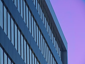 Modern Office Building Facade Against Purple Sky