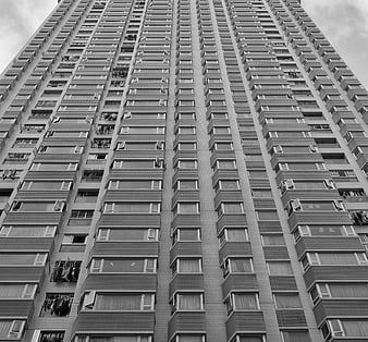 Black and white low angle view of high-rise apartment building facade