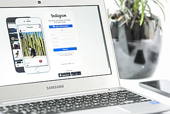 Samsung Laptop Displaying Instagram Sign Up Page on Desk
