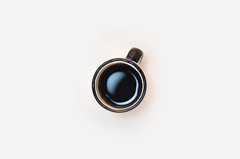 Minimalist Top-Down Black Coffee Cup On White Background