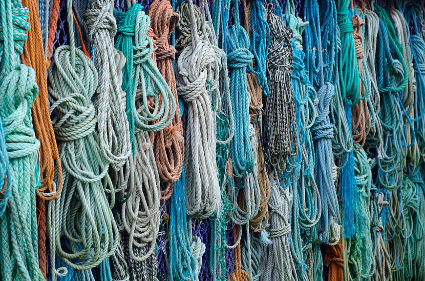 Colorful Hanging Ropes and Knots Texture Background