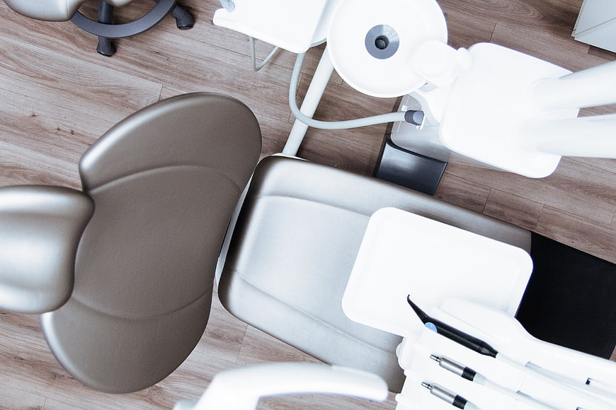 Top View of Empty Modern Dental Chair and Equipment